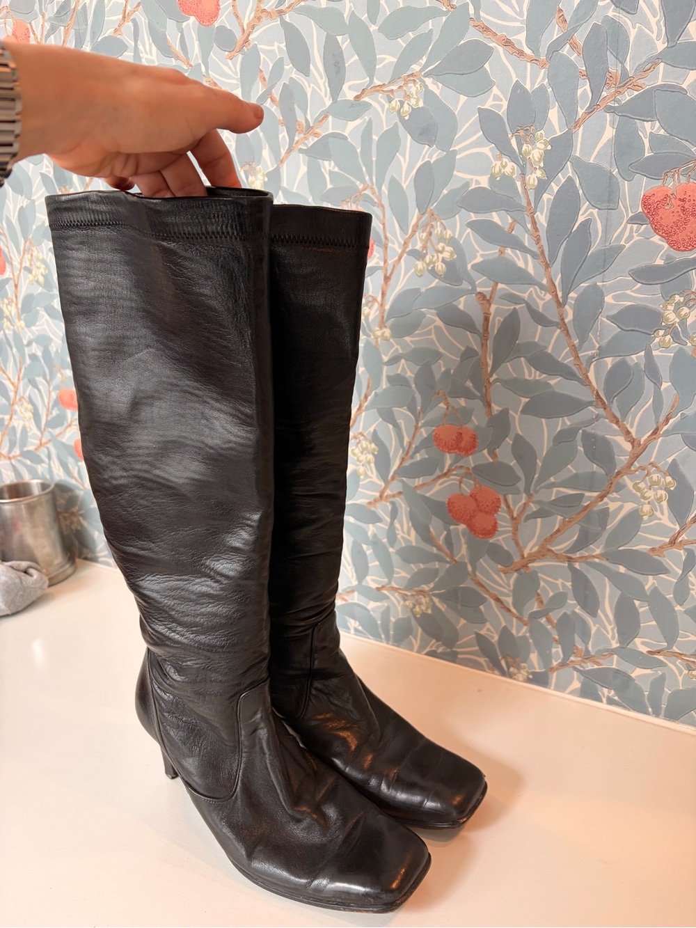 Vintage Cole Haan black leather tall boots with a sleek, minimalist silhouette